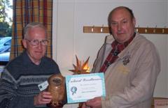 John Brocklehurst receiving the runner up certificate from Peter Blake